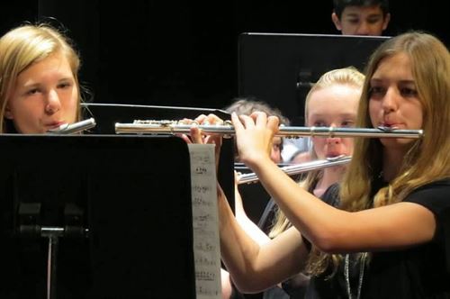 closeup of students playing flutes